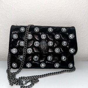 Black patent leather small Kurt Geiger crossbody or shoulder bag.